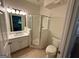 Bathroom with tiled floor, glass shower stall, white toilet, and vanity sink at 101 Dancing Fox Rd, Decatur, GA 30032