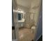 Bathroom with tiled floor, glass shower stall, white toilet, and vanity sink at 101 Dancing Fox Rd, Decatur, GA 30032