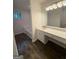 Bathroom features hardwood floors, bathtub, large mirror, and vanity at 101 Dancing Fox Rd, Decatur, GA 30032