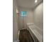 Bathroom features hardwood floors, bathtub, and a glass enclosed shower at 101 Dancing Fox Rd, Decatur, GA 30032