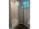 Bright shower with tiled walls, glass door, and window at 101 Dancing Fox Rd, Decatur, GA 30032