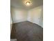 This bedroom is carpeted and has white painted walls and a white door at 101 Dancing Fox Rd, Decatur, GA 30032