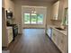 Modern kitchen with white cabinets, stainless steel appliances, and hardwood floors at 101 Dancing Fox Rd, Decatur, GA 30032