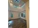 Bright, open living room with vaulted ceiling, modern ceiling fan, and sleek floors at 101 Dancing Fox Rd, Decatur, GA 30032