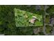 Aerial view of the house and lot backed by dense woods, highlighting the property's seclusion and natural beauty at 1788 River Bluff Vw, Duluth, GA 30097