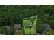 Aerial view of a house on a treed lot in a verdant neighborhood, providing privacy and a natural setting at 1788 River Bluff Vw, Duluth, GA 30097