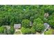 Aerial view of a neighborhood showing the lot's location in a community with mature trees and landscaping at 1788 River Bluff Vw, Duluth, GA 30097