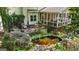 Beautiful backyard koi pond surrounded by lush foliage and a charming patio area, creating a peaceful retreat at 1788 River Bluff Vw, Duluth, GA 30097