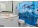 Bright bathroom with white vanity, and a shower featuring a dolphin-themed shower curtain at 1788 River Bluff Vw, Duluth, GA 30097