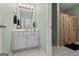Cozy bathroom with vanity, mirror, and tile floor, features a separate room with shower at 1788 River Bluff Vw, Duluth, GA 30097