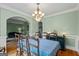 Spacious dining room offering ample seating, decorative trim, and seamless connection to other living spaces at 1788 River Bluff Vw, Duluth, GA 30097