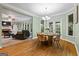 Cozy dining room adjoining living area, filled with natural light and hardwood flooring at 1788 River Bluff Vw, Duluth, GA 30097