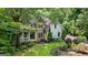 Charming two-story home with a stone facade, a covered porch, and meticulously landscaped front yard at 1788 River Bluff Vw, Duluth, GA 30097