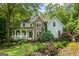 Stunning home with a manicured lawn, stone accents, and inviting front porch at 1788 River Bluff Vw, Duluth, GA 30097