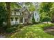 Beautiful home with lush landscaping, a stone facade, and a welcoming front porch at 1788 River Bluff Vw, Duluth, GA 30097