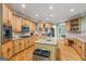 Spacious kitchen boasts custom cabinets, granite countertops, hardwood floors, and stainless steel appliances at 1788 River Bluff Vw, Duluth, GA 30097