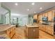 Well-appointed kitchen with granite countertops, stainless appliances, hardwood floors, and a breakfast area at 1788 River Bluff Vw, Duluth, GA 30097