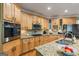 Gourmet kitchen features granite counters, stainless appliances, and ample storage at 1788 River Bluff Vw, Duluth, GA 30097