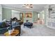 Open-concept living room featuring plush seating, stylish decor, and seamless flow to other living spaces at 1788 River Bluff Vw, Duluth, GA 30097
