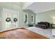 Bright living room with French doors, vaulted ceilings, and a comfortable seating area, filled with natural light at 1788 River Bluff Vw, Duluth, GA 30097