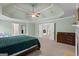 Large main bedroom boasts tray ceiling, neutral carpet, and bright white trim and millwork throughout at 1788 River Bluff Vw, Duluth, GA 30097