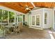 Inviting screened porch with wood ceiling offers a relaxing outdoor living space at 1788 River Bluff Vw, Duluth, GA 30097