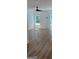 Spacious bedroom featuring wood-look flooring, a ceiling fan, and lots of natural light at 5502 Lakeview Pkwy, Villa Rica, GA 30180