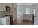 Modern kitchen featuring stainless steel appliances, subway tile backsplash, and eat-in area at 5502 Lakeview Pkwy, Villa Rica, GA 30180