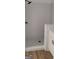 Bright bathroom showcases a white tiled shower and a white vanity with black hardware at 5502 Lakeview Pkwy, Villa Rica, GA 30180