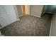 Bedroom with new carpet, trim, neutral paint, and a closet at 120 E Cainwood E Ct, Atlanta, GA 30349