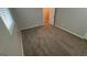 Bedroom featuring neutral colors, fresh carpet, and a window at 120 E Cainwood E Ct, Atlanta, GA 30349