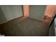 Bedroom with carpet flooring, neutral walls, and a view of an ensuite bathroom at 120 E Cainwood E Ct, Atlanta, GA 30349