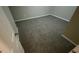 Bedroom with neutral paint, new carpet, and freshly painted trim at 120 E Cainwood E Ct, Atlanta, GA 30349
