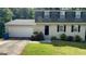 Charming home with a manicured lawn, two-car garage, and traditional curb appeal at 120 E Cainwood E Ct, Atlanta, GA 30349