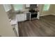 This kitchen features stainless steel appliances, modern cabinets and vinyl flooring at 120 E Cainwood E Ct, Atlanta, GA 30349