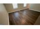 Bright living room area featuring attractive vinyl flooring and natural light at 120 E Cainwood E Ct, Atlanta, GA 30349