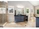 Luxury bathroom featuring dual sinks, granite countertops, glass shower, and soaking tub under windows at 1884 Whitehawk Ct, Lawrenceville, GA 30043