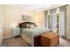Cozy bedroom showcases a well-made bed, neutral walls, ample natural light, and tasteful furnishings at 1884 Whitehawk Ct, Lawrenceville, GA 30043