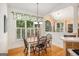 Sun-filled breakfast area with large windows, a vaulted ceiling, and hardwood floors at 1884 Whitehawk Ct, Lawrenceville, GA 30043