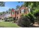 Charming brick home with lush landscaping and a well-manicured lawn creating great curb appeal at 1884 Whitehawk Ct, Lawrenceville, GA 30043