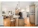 Open-concept kitchen with a breakfast bar, stainless steel appliances, and hardwood floors at 1884 Whitehawk Ct, Lawrenceville, GA 30043