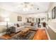 Spacious living room with hardwood floors, comfortable seating, and natural light at 1884 Whitehawk Ct, Lawrenceville, GA 30043
