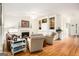 Spacious living room with hardwood floors, a fireplace, and built-in shelving at 1884 Whitehawk Ct, Lawrenceville, GA 30043