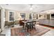 Bright living room featuring windows, comfortable seating and hardwood floors at 1884 Whitehawk Ct, Lawrenceville, GA 30043