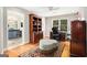 Well-appointed home office with built-in bookshelves, desk, and chair offers an inspiring work environment at 1884 Whitehawk Ct, Lawrenceville, GA 30043