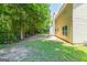 View of the rear of the house showing the backyard surrounded by greenery and trees at 260 Redding Rdg, Atlanta, GA 30349