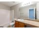 Well-lit bathroom with a single sink vanity, bathtub, and neutral color scheme at 260 Redding Rdg, Atlanta, GA 30349
