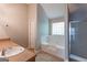 Bathroom with garden tub, separate shower and single sink vanity at 260 Redding Rdg, Atlanta, GA 30349