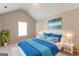 Cozy bedroom featuring a queen-sized bed with stylish blue and white bedding and ample natural light at 260 Redding Rdg, Atlanta, GA 30349