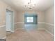 Traditional dining room with chandelier lighting and neutral paint at 260 Redding Rdg, Atlanta, GA 30349